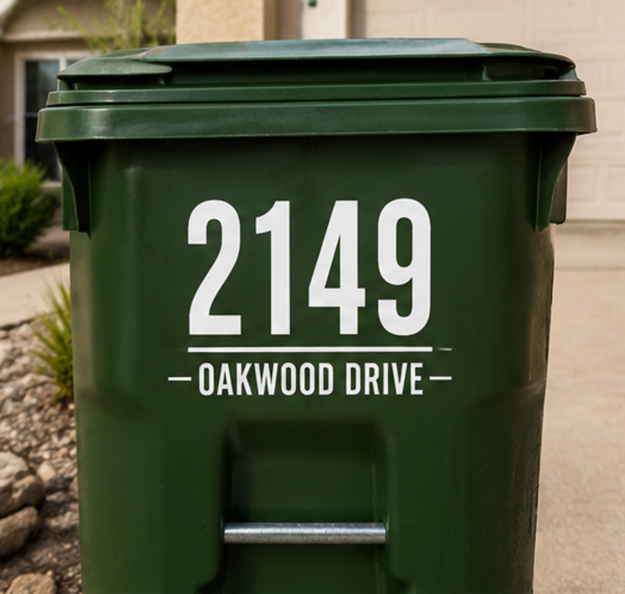 White 2149 Oakwood Drive decal on a green bin